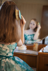 girl brushing hair